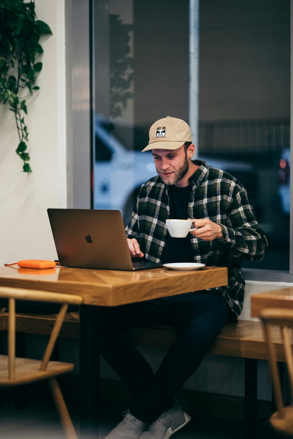 Students studying with laptops and coffee at Stellos